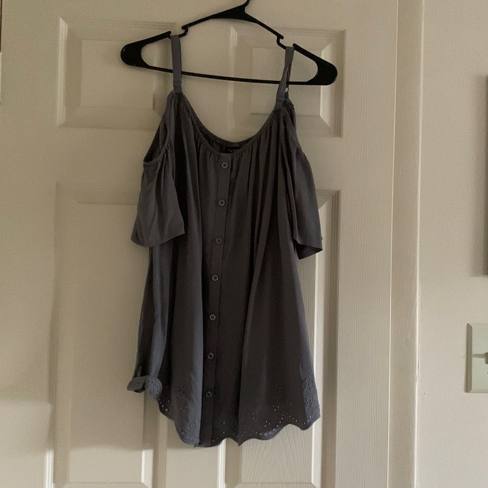 Dark gray shirt that has sleeves that go off the shoulder and is New, Never worn
